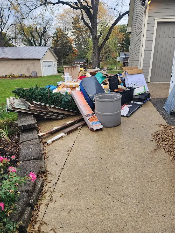 Dumpster being loaded with debris for Commercial Dumpster Rental in Cheviot